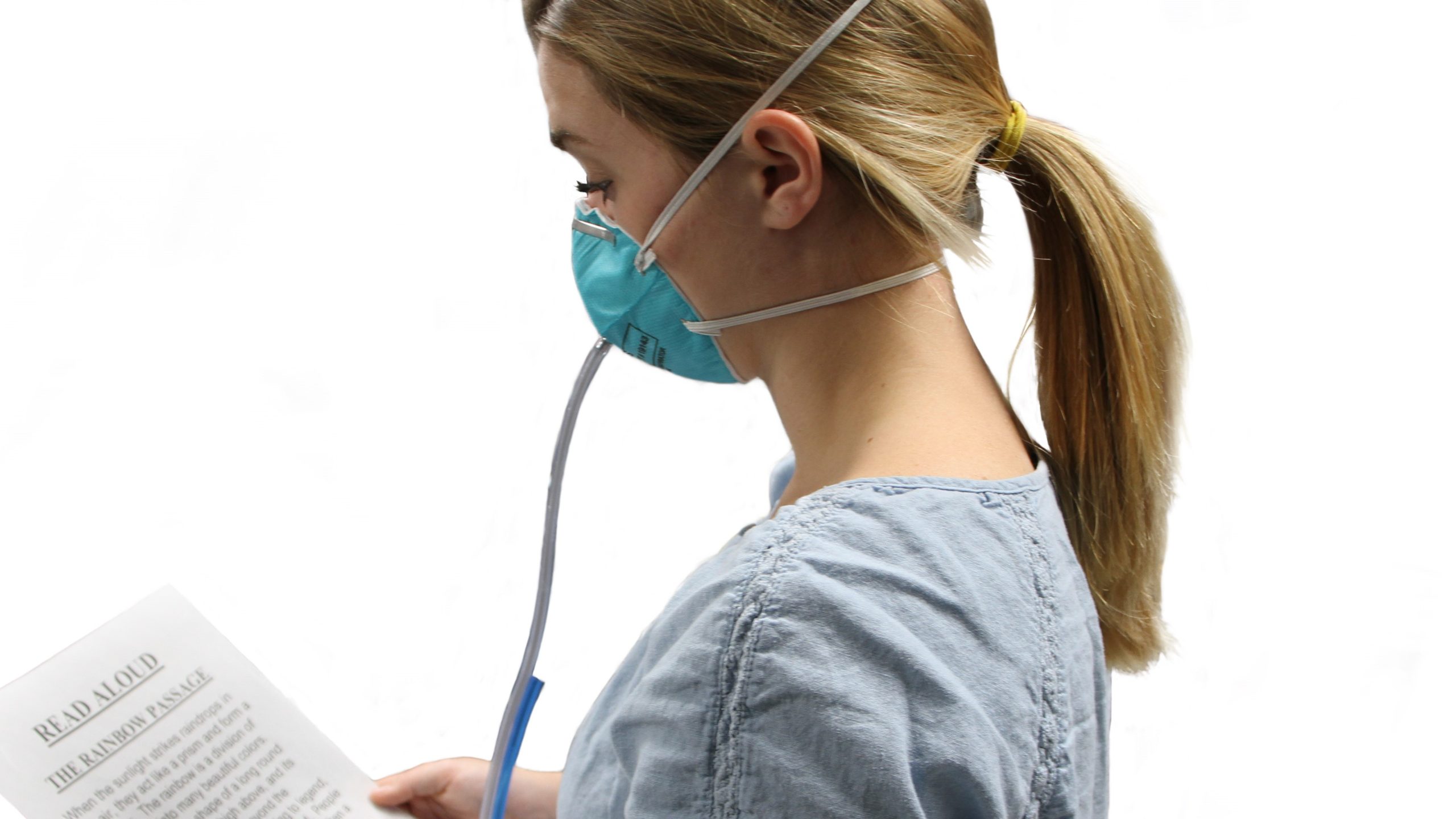 A person wearing a respirator and reading the "rainbow passage" script aloud as part of a quantitative fit test